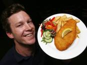 North Wollongong Hotel manager Steve Moore with the popular chicken schnitty, which caused a bit of a ruckus in 2015. Picture by Robert Peet