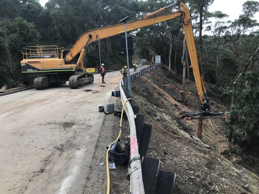 Work being carried at along Lawrence Hargrave Drive at Stanwell Park ... it will finish next weekend and the road will be re-opened. Picture: Transport for NSW