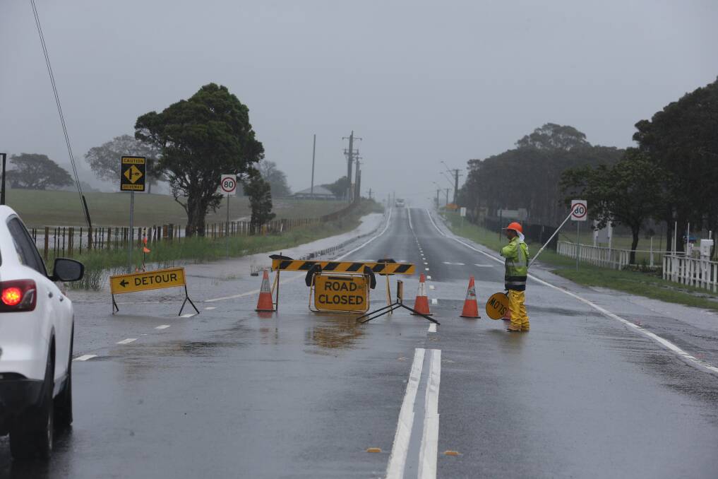 A section of Tongarra Road closed by flooding in 2020 ... Shellharbour City Council has voted to push the state government to take action on the "absolute nightmare" of the road. Picture: Robert Peet