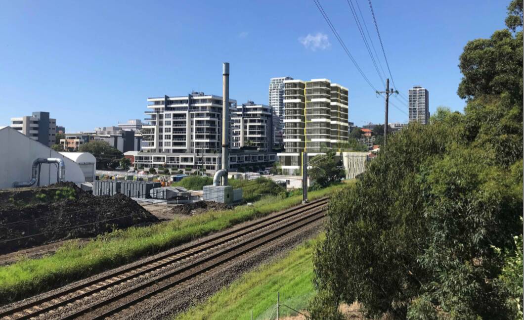 Train line: The apartment complex (centre) looking east from the area of Denison Street, with the rail line in the foreground. Picture: supplied