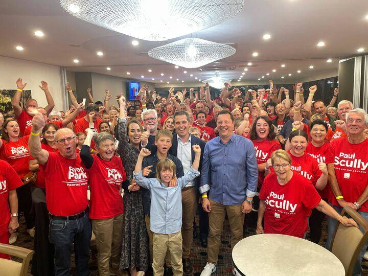 Ryan Park and Paul Scully celebrate their emphatic re-election at the Figtree Sports and Bowling Club on Saturday night.
