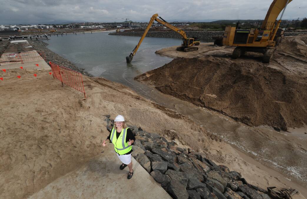 Dig it: Shellharbour Mayor Marianne Saliba gives the thumbs up to opening of a channel between the Shell Cove marina and the ocean. Picture: Robert Peet
