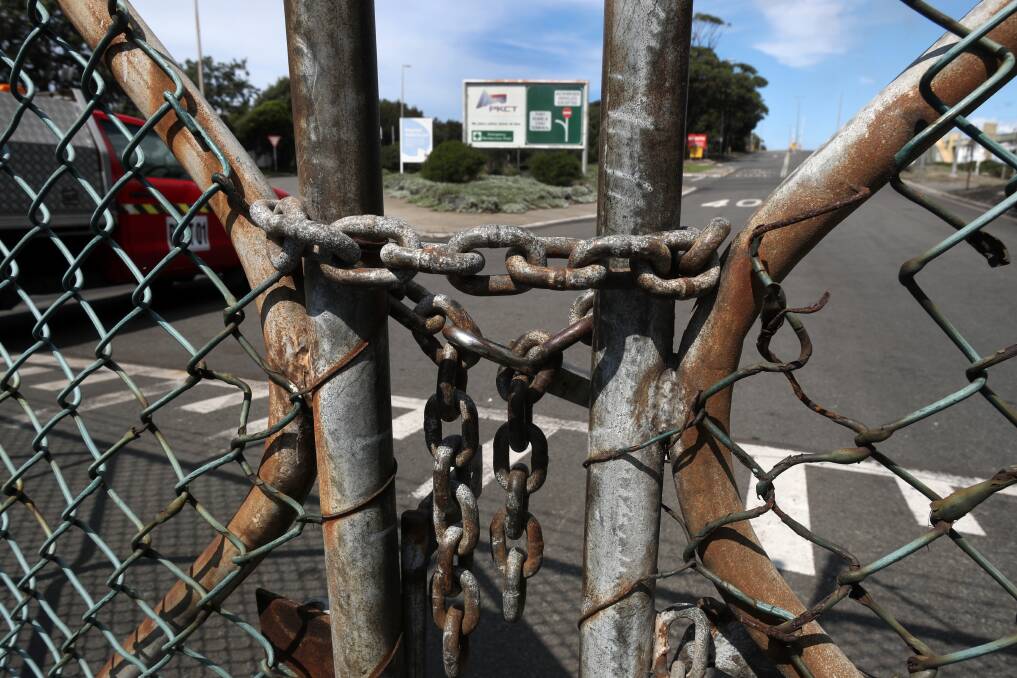 The padlock on the Port Kembla Coal Terminal will remain in place until April after the company locked out its workers yet again. Picture: Robert Peet