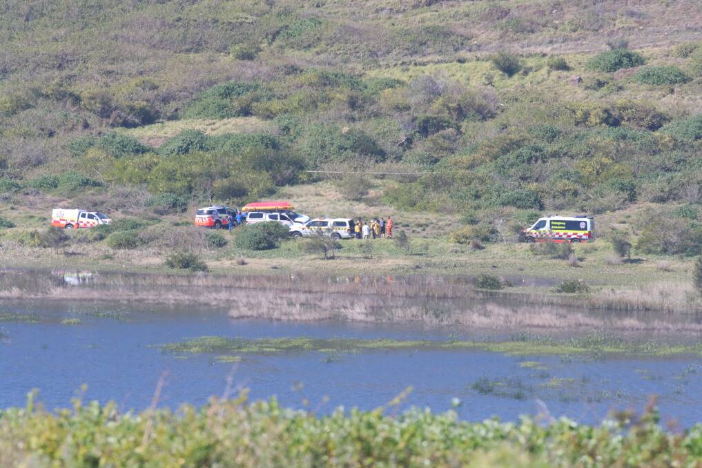 Emergency services crews at Killalea Lagoon, where the body of missing man Albert Sovrano was discovered on Sunday at around noon. Picture: Sylvia Liber
