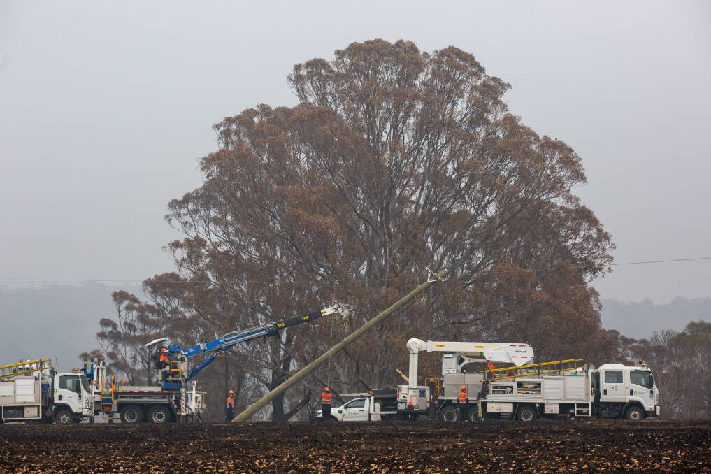 Endeavour Energy crews working to repair the bushfire-damaged power network on the South Coast. Picture: supplied