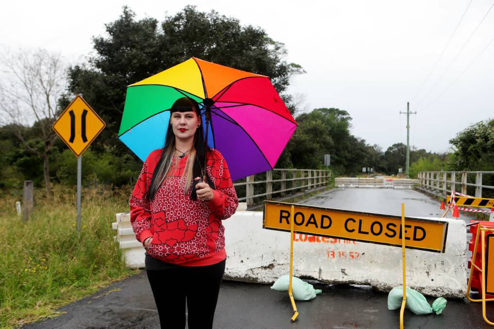Petition: Kembla Grange resident Rebekah Murray-Smith lives on Darkes Road, which has been closed since April. She has started a petition calling on council to speed up the repairs. Picture: Sylvia Liber