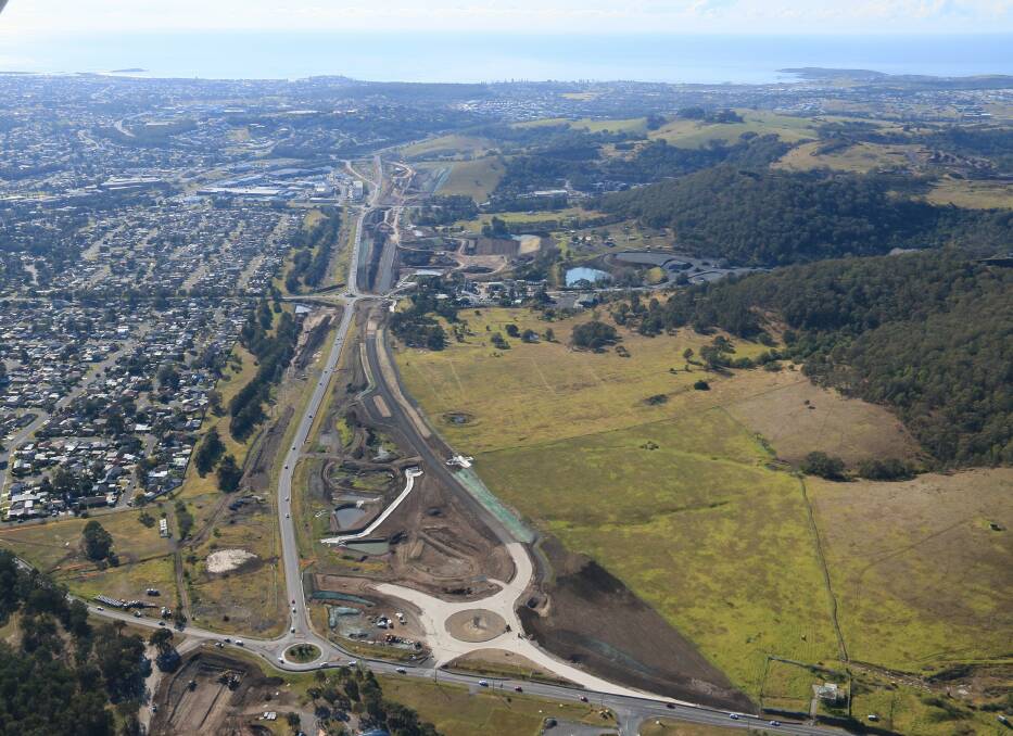 Road: The section of the East West Link - seen here under construction at the right - will be open next week. The road forms part of the Albion Park Rail bypass project. Picture: Colin F. Douch