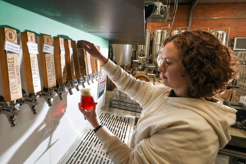 Bitter: Five Barrel's Lucy Timpano pours a beer, which will cost more now that the government's excise tax has gone up again. Picture: Adam McLean