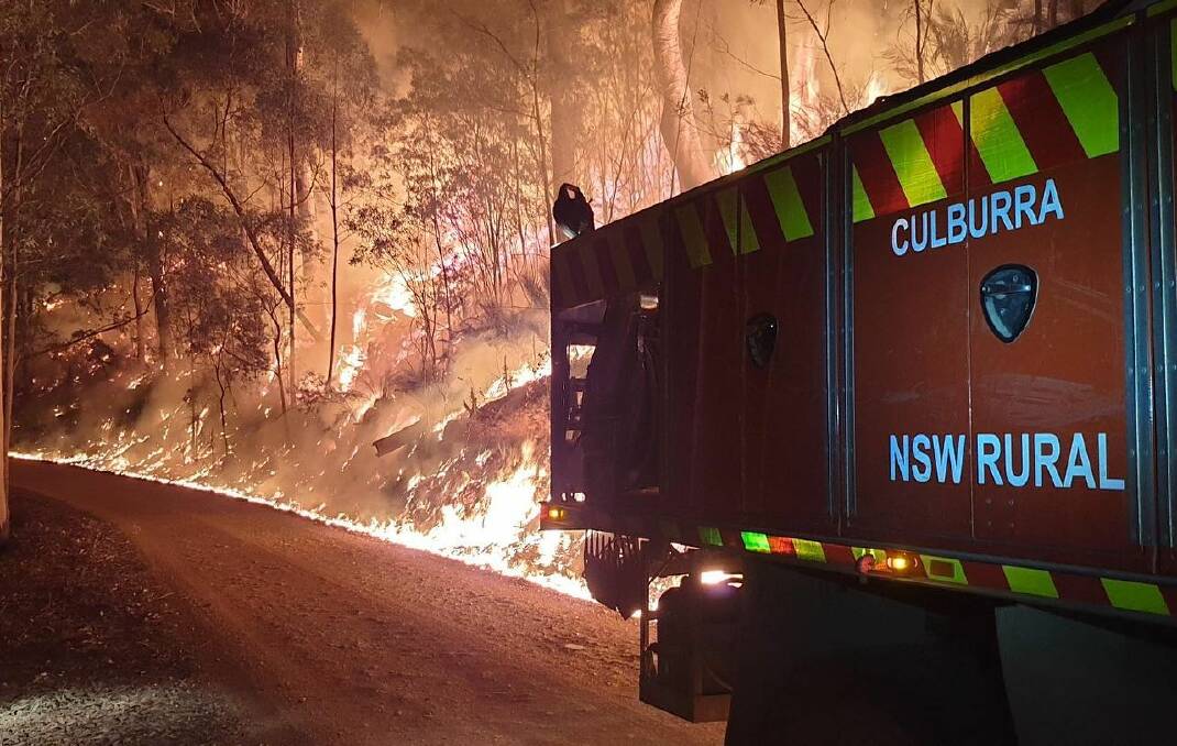 Bushfires, as well as drought and issues with water supply, are sapping the energy and resilience of those who live in regional NSW. Picture: Culburra Beach Rural Fire Brigade