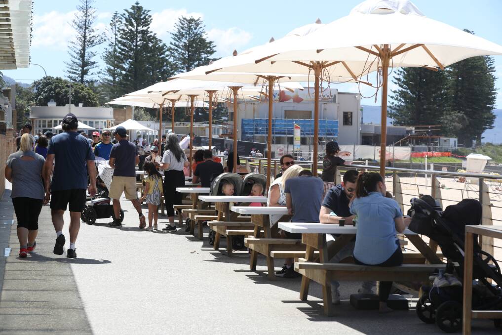 Getting out: For the first weekend since restrictions were lifted waterside cafes and parks were busy but few people actually ventured down to the sand. Picture; Robert Peet 