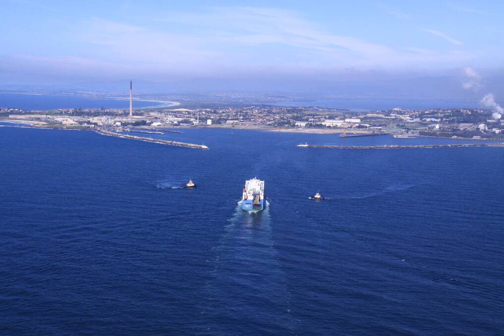 Port of call: The view ships get as they enter the port of Port Kembla, with two tugs circling in preparation to help guide it through the breakwaters and into the appropriate berth.