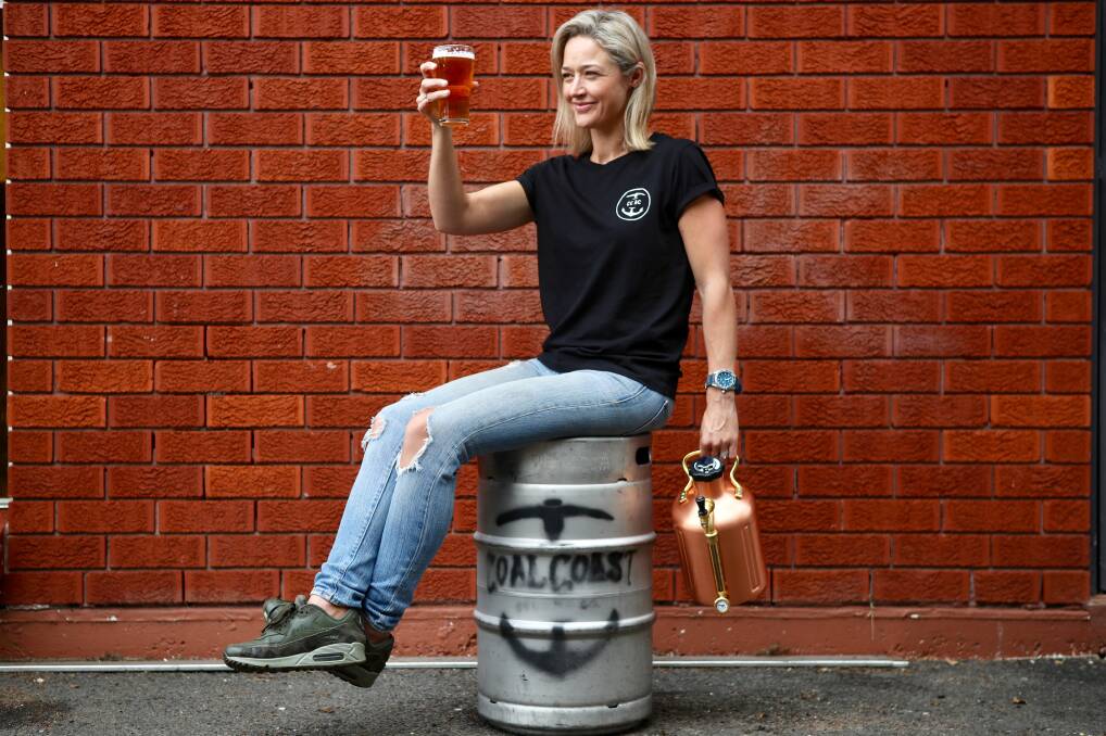 Cheers: Kelly Carey from Austinmer's Coal Coast Brewing Company checks out their debut release - Pit Pony pale ale. Picture: Adam McLean