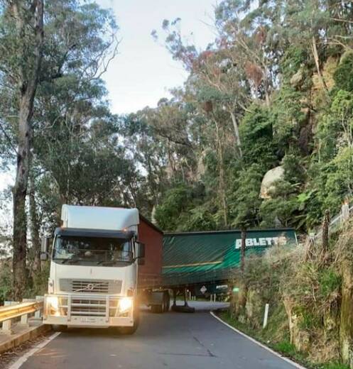 Whoops: The truck that got stuck on the tricky bends along Macquarie Pass on Monday. Picture: Facebook