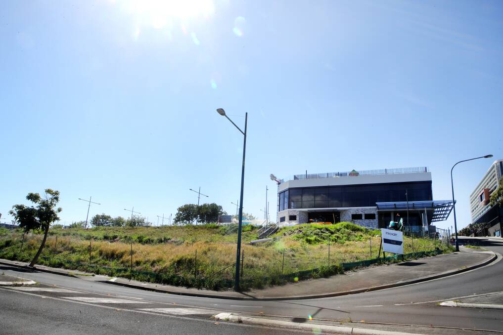 Storeys: Shellharbour council staff is considering an application to build a 50-unit apartment complex on this vacant block in the city CBD. Picture: Sylvia Liber