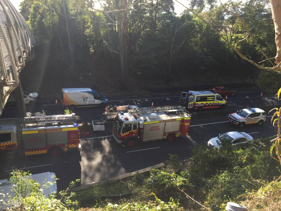 Emergency services on the scene of a three-car accident on the M1 Princes Motorway, underneath the New Mt Pleasant Road overpass. Picture: Sylvia Liber