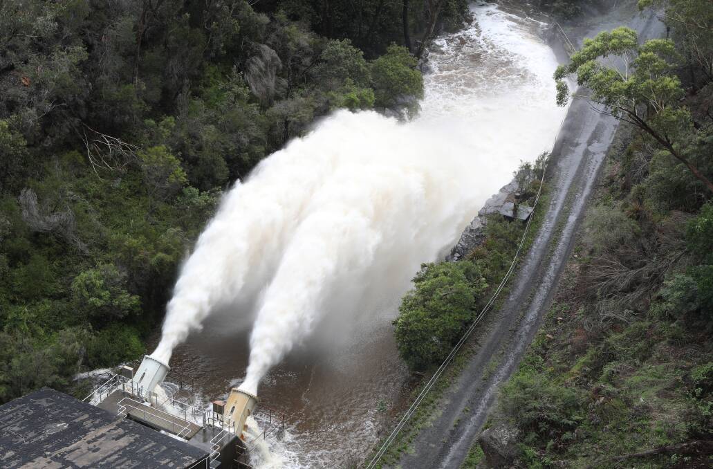 The spillway at Cataract Dam in operation last week - with dams filling up, the government is looking to ease water restrictions next month. Picture: Robert Peet
