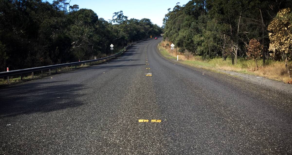 Half a job: Six weeks after Appin road was resurfaced, motorists using Appin Road are still waiting for RMS staff to provide line markings.