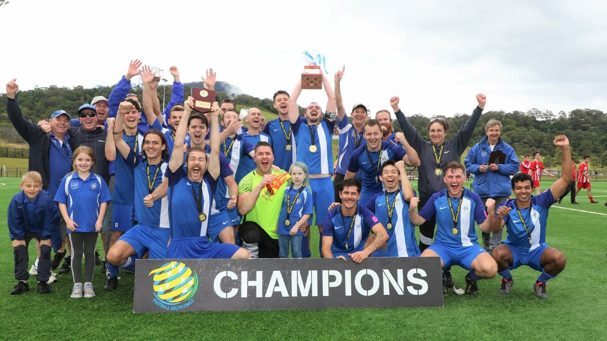 Thirroul players, coaches and family members celebrate after winning the District League Second Grade premiership on Saturday. Picture: Pedro Garcia