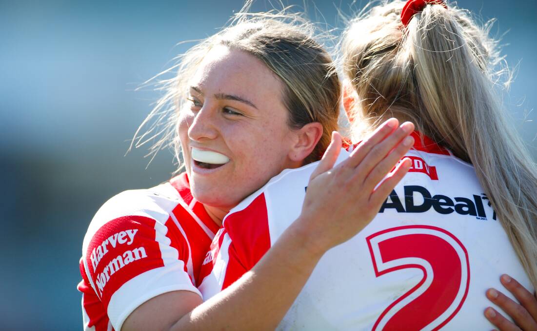 EXCITED: Teagan Berry (right) celebrates with a Dragons teammate at WIN Stadium on Sunday. Picture: Anna Warr