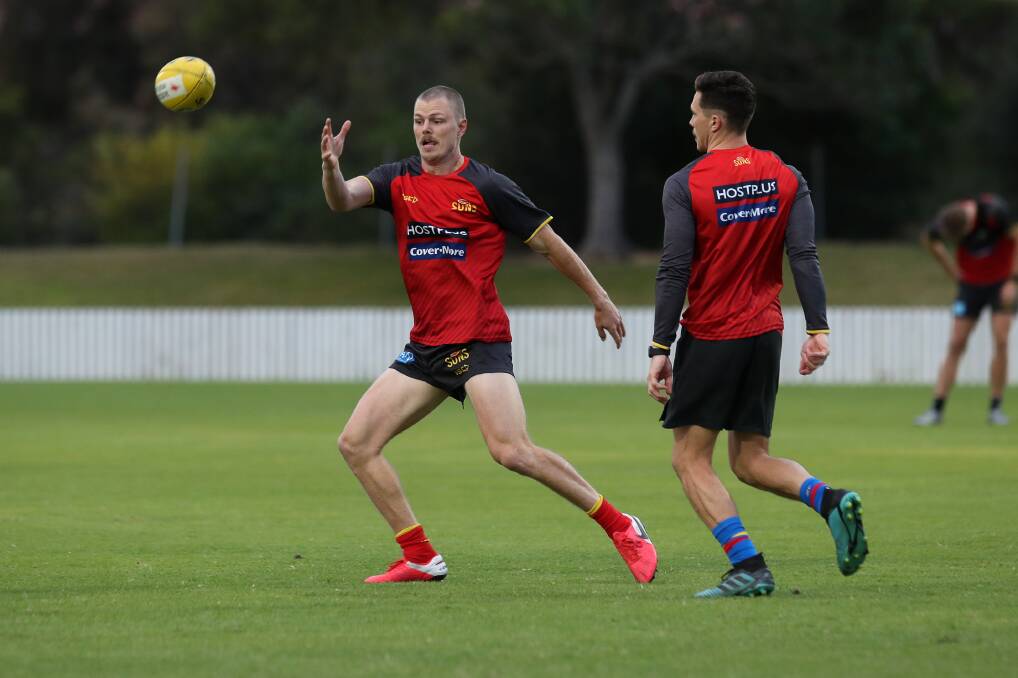 FOCUSED: Suns forward Nick Holman looks to grab possession at training on Friday at North Dalton Park. Picture: Sylvia Liber