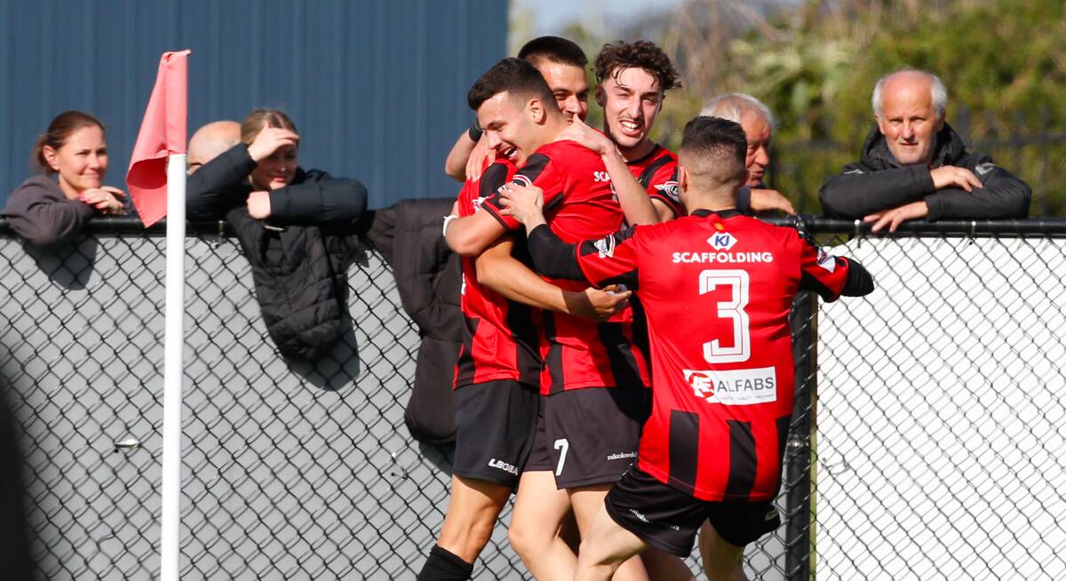 Cringila striker Peter Simonoski - pictured here celebrating with teammates last year - found the back of the net for the Lions on Friday night. Picture by Anna Warr