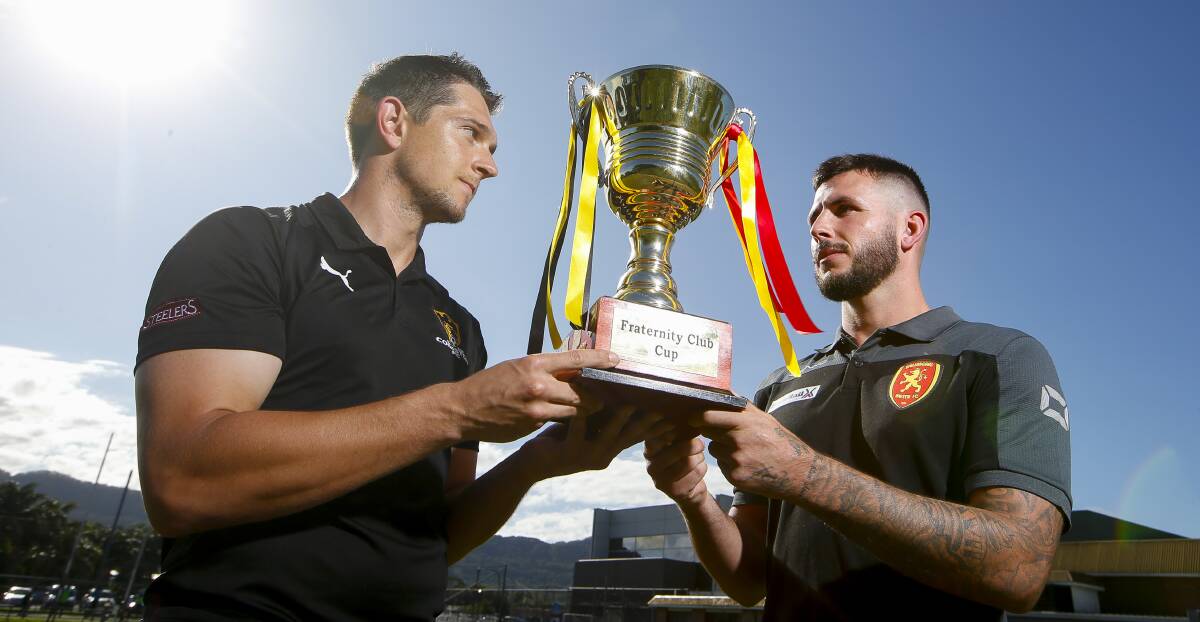 READY TO GO: Coniston's Blake Horton and James O'Rourke from Wollongong United hold up the Frat Cup trophy back in March. Picture: Anna Warr
