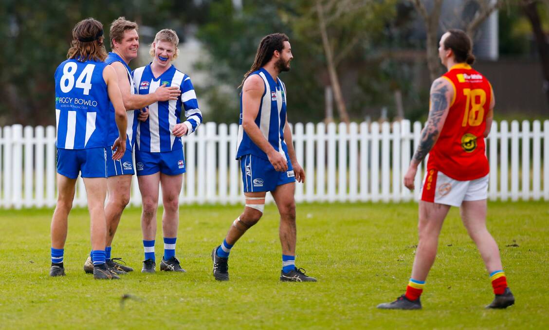 HAPPY DAYS: Ben Bourke (second from left) celebrates a goal with his Kangaroos teammates at Figtree Oval on Saturday afternoon. Picture: Anna Warr