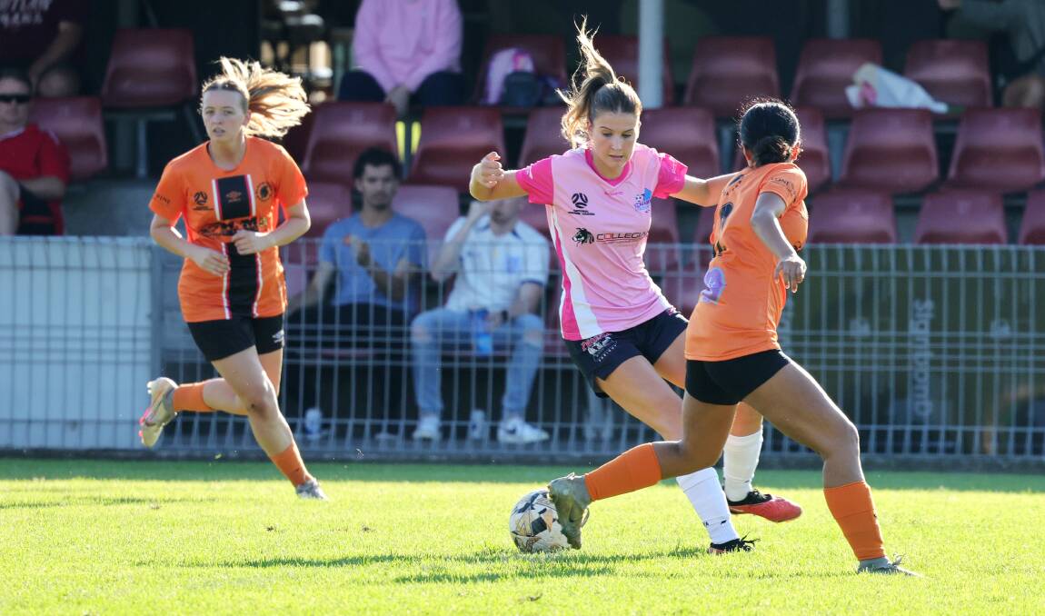 Stingrays player Layla Etherington dances her way around a Blacktown opponent during a recent game at Macedonia Park. Picture by Sylvia Liber