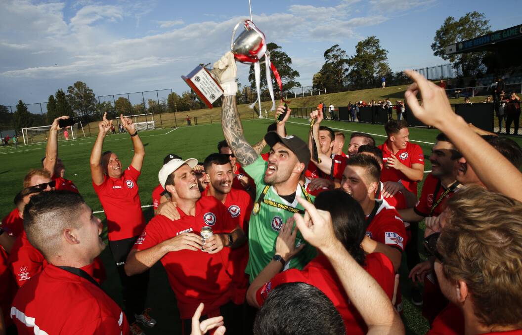 GLORY: Oak Flats players and coaches celebrate after claiming the 2020 District League premiership on Saturday. Picture: Anna Warr