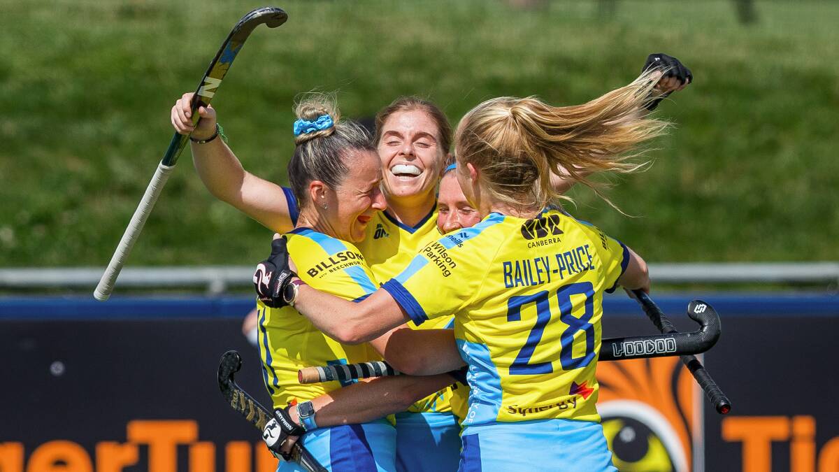 Canberra Chill's Tamsin Bunt, Katie Mullan, Naomi Evans and Catriona Bailey-Price celebrate after they beat reigning champions NSW Pride to book their spot in Sunday's Hockey One grand final. Picture by Sitthixay Ditthavong