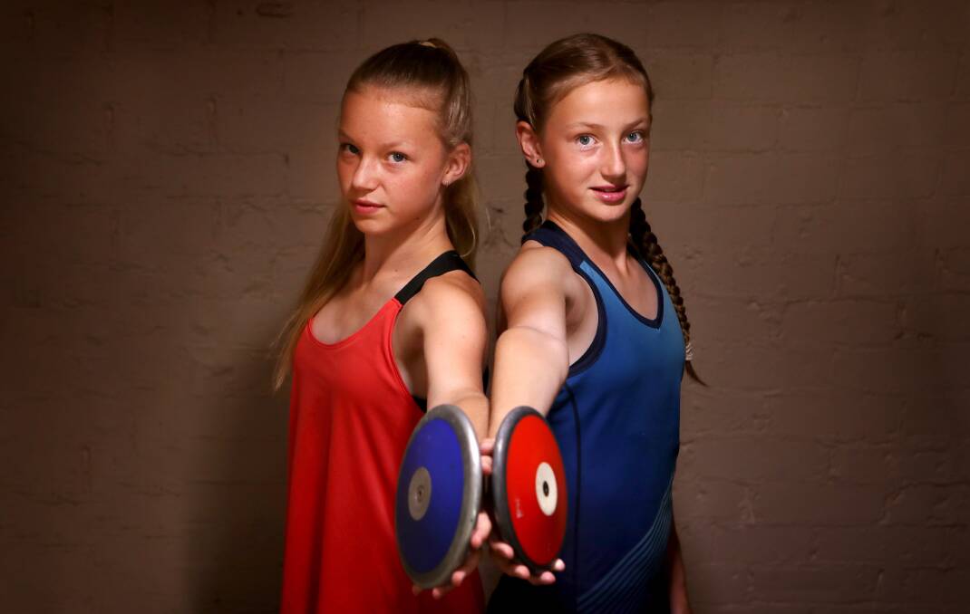 EYES ON THE PRIZE: Balgownie sisters Jamaya and Chelsy Wayne, 13 and 12 respectively, are very competitive when it comes to discus. Picture: Sylvia Liber