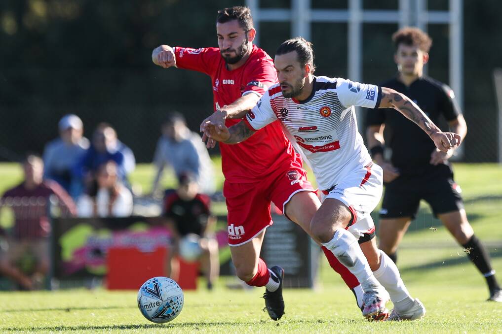 STAYING FOCUSED: Wollongong Wolves player Ethan Kambisios (left) battles for possession during a recent game against Rockdale. Picture: Adam McLean
