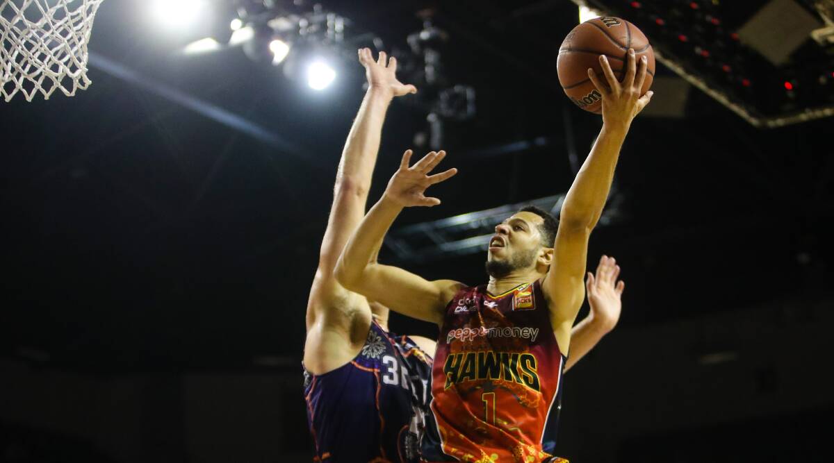 IN THE SPOTLIGHT: Tyler Harvey flies towards the basket during Illawarra's win over the 36ers on Sunday afternoon. Picture: Adam McLean