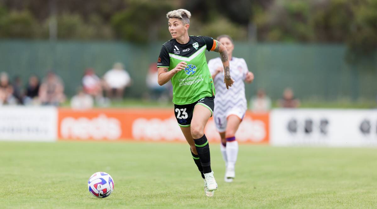 Canberra United captain Michelle Heyman chases after the ball during Saturday's clash with the Glory at McKellar Park. Picture by Sitthixay Ditthavong 
