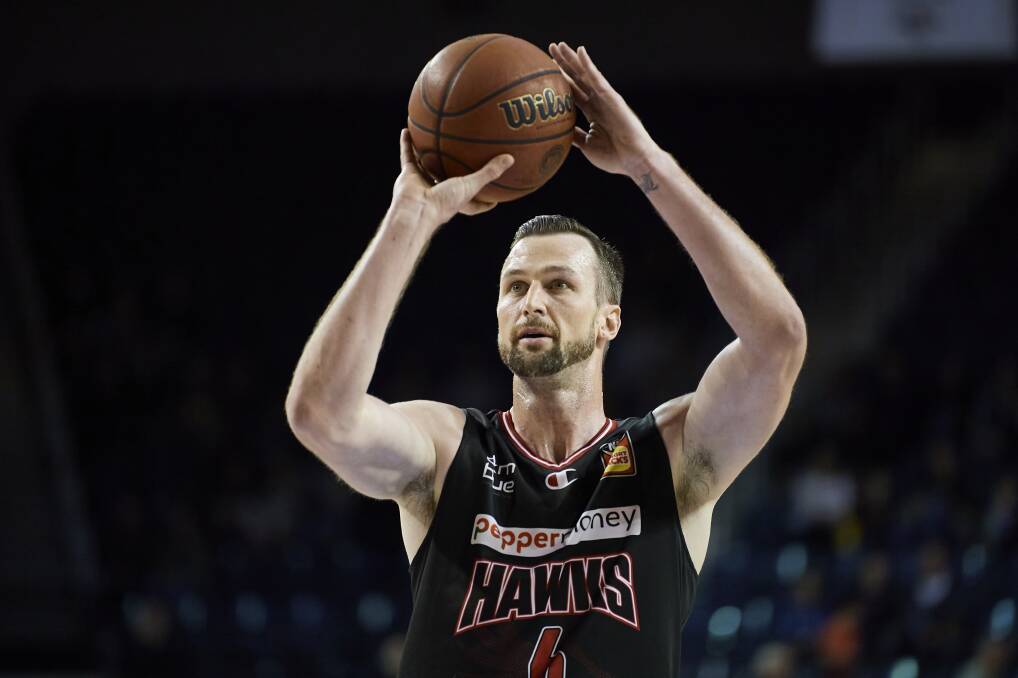 LOOKING FORWARD: AJ Ogilvy prepares to shoot during the Hawks' win on Sunday at the WEC. Picture: Brett Hemmings/Getty Images