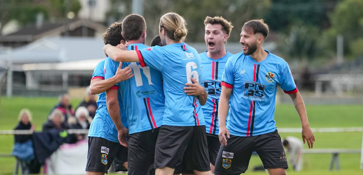 Shellharbour players celebrate together after scoring a goal against Unanderra earlier this year. Picture - @gragrapix