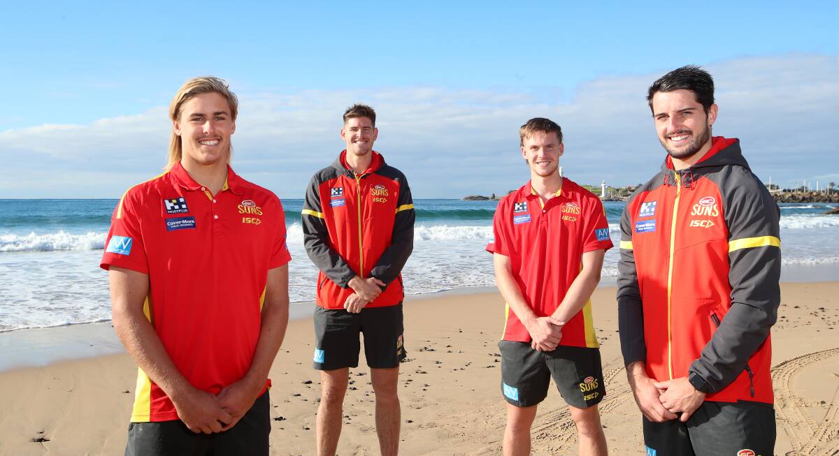 All of the action from the official welcoming ceremony for the Gold Coast Suns at North Wollongong Beach on Monday morning. Pictures: Sylvia Liber