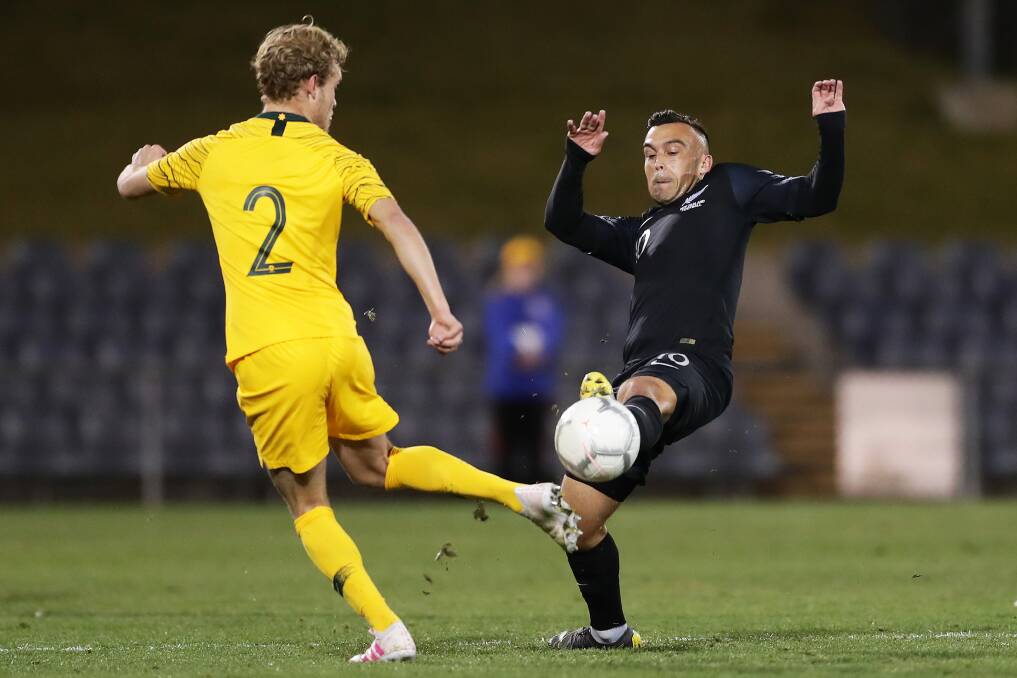 FOCUSED: Clayton Lewis (right) challenges an Australian opponent for possession while representing the New Zealand under-23s side in 2019. Picture: Matt King/Getty Images
