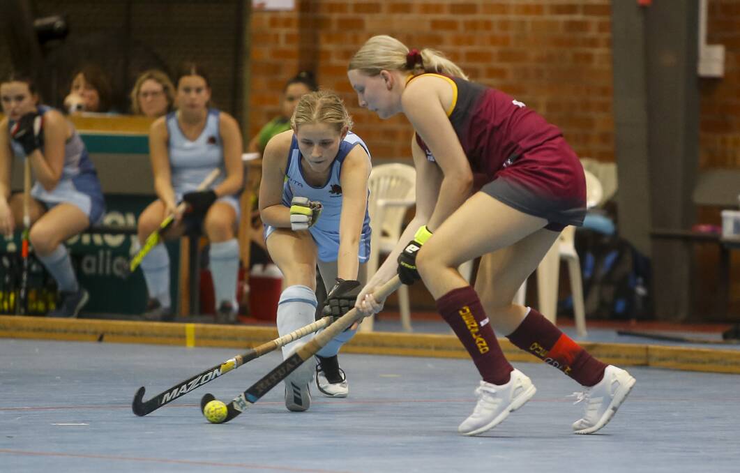 FOCUSED: West Wollongong's Ella Gibson challenges a Queensland opponent for possession. Picture: Anna Warr