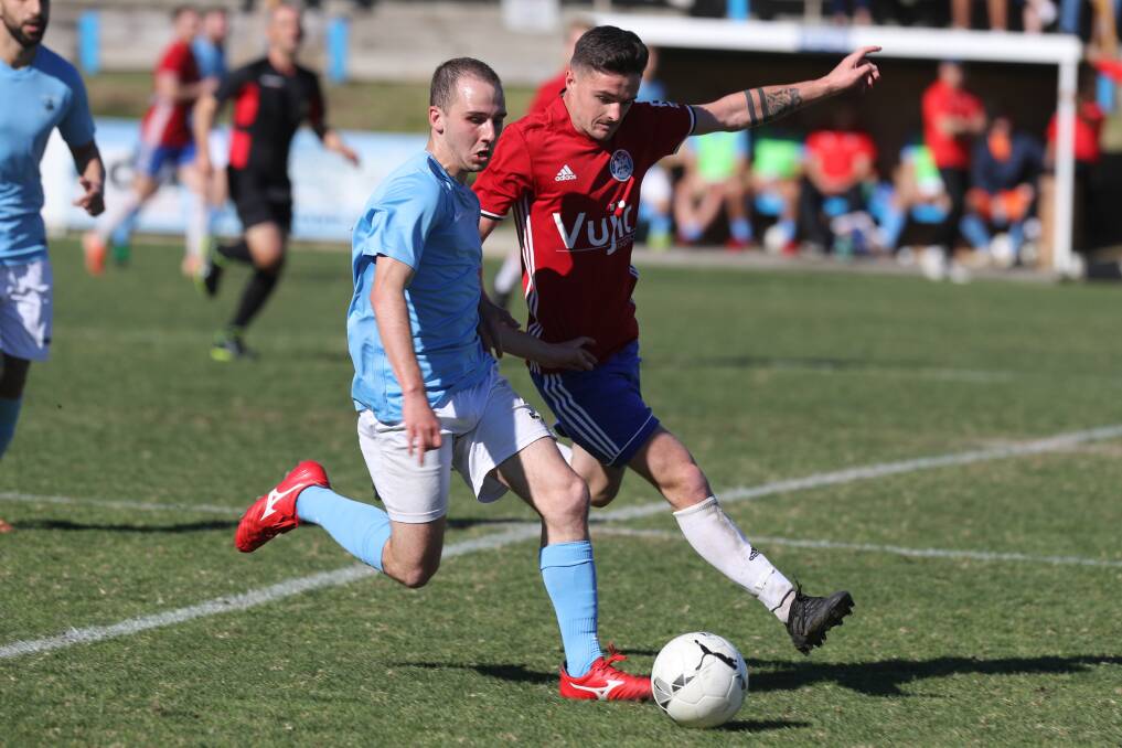 ON THE BALL: Corrimal's Jason Zufic and Albion Park opponent Cody Waller compete for possession during an Illawarra Premier League game last year. Picture: Robert Peet