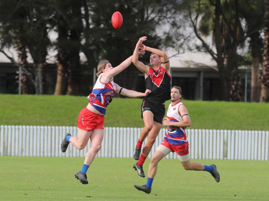 Lions player Harry Marning flies high to take a mark against the Bulldogs this year. Picture by Robert Peet