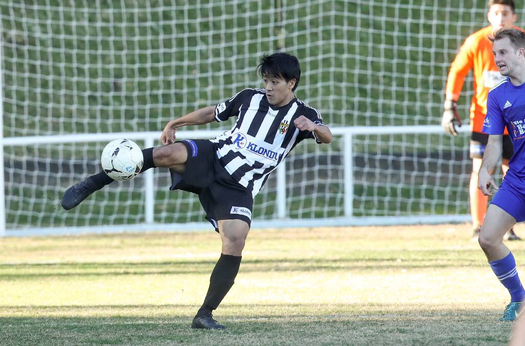 EYES ON THE BALL: Port Kembla's Nobi Mochizuki traps possession during a Premier League game last year. Picture: Adam McLean
