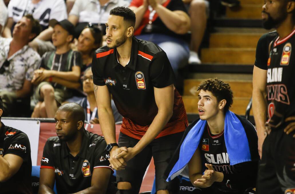 Josh Boone (centre) on the bench during Illawarra's recent game against Perth Wildcats. Picture: Anna Warr