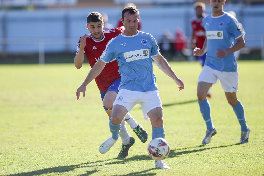 LOOKING FORWARD: Chris Price - who has re-committed to the club for 2022, controls possession for Olympic during a game last year. Picture: Adam McLean