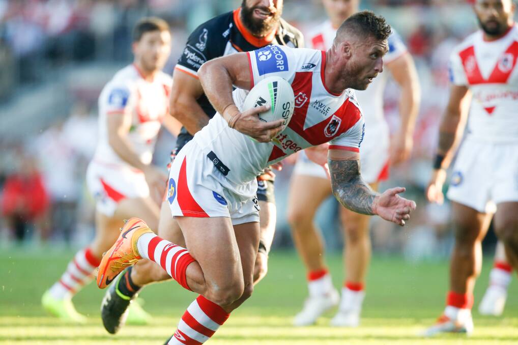 WORKING HARD: Tariq Sims charges towards the tryline against the Tigers on Sunday. Picture: Anna Warr