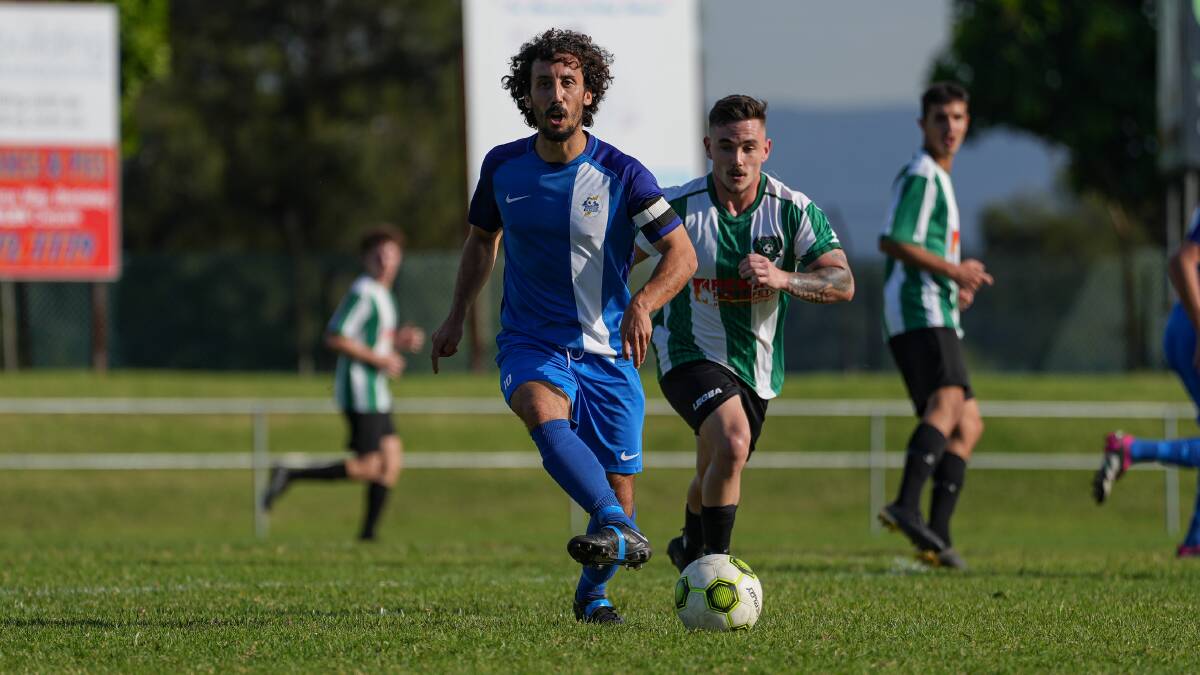 Nathan Mucci passes the ball to a Thirroul teammate during a recent match against Berkeley Sports. Picture - @gragrapix
