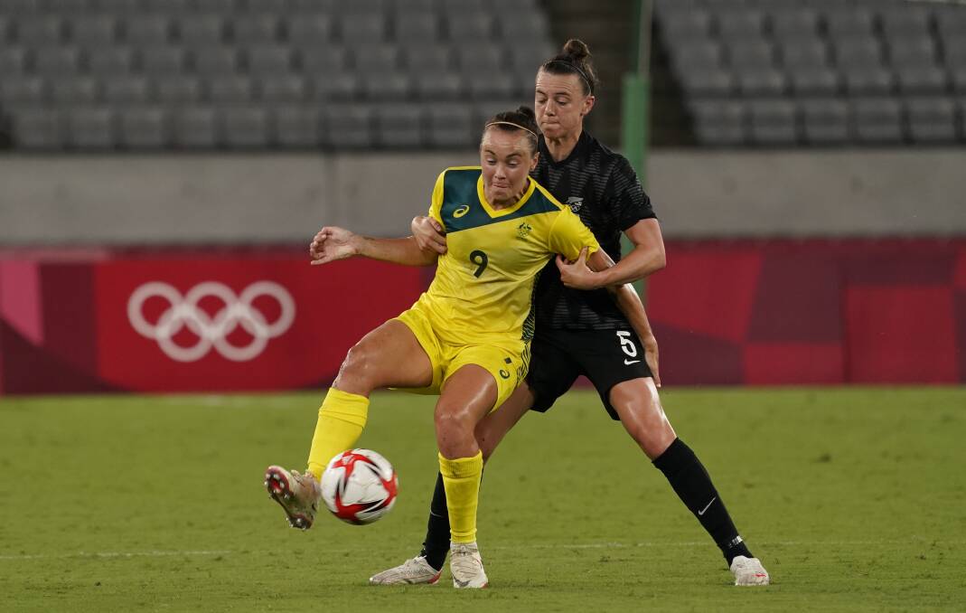 BACK ON DECK: Caitlin Foord battles for the ball with New Zealand defender Meikayla Moore at Tokyo Stadium. Picture: Jack Gruber/USA TODAY/Network/Sipa USA