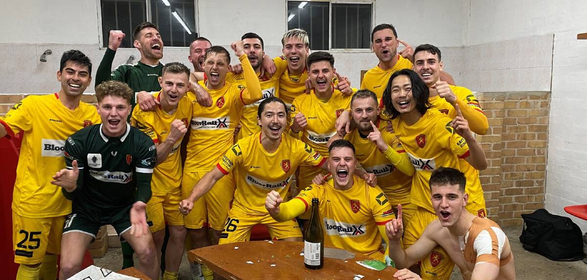 Wollongong United players celebrate after winning the 2022 Illawarra Premier League title on Friday night. Picture by Richie Wagner/Wollongong United FC
