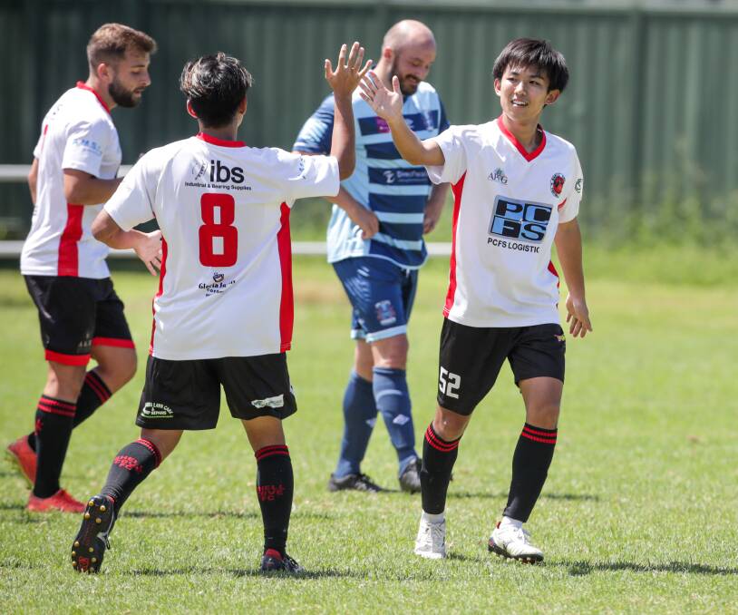 Shellharbour's Yuko Kito celebrates a goal with his teammate last Saturday. Picture by Adam McLean