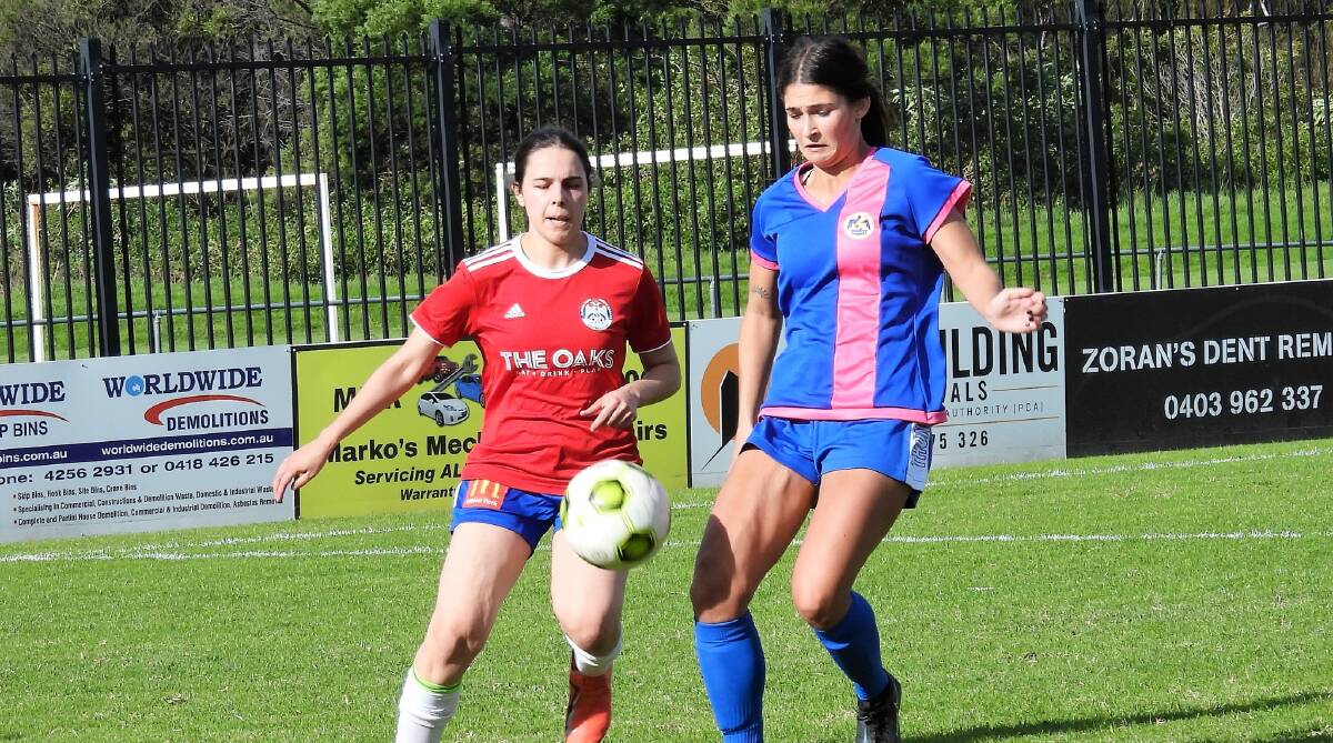 Thirroul midfielder Jamie Ryan (right) prepares to trap the ball ahead of her Albion Park opponent earlier this year. Picture - Soccer Shots Illawarra